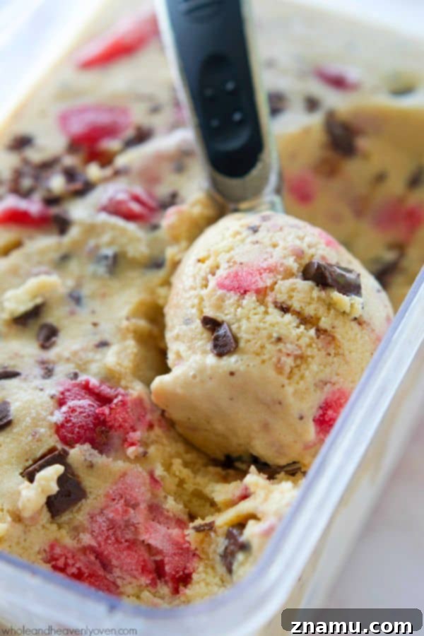 Crimson Chip Swirl Bliss 2 Creamy Strawberry Swirl Chocolate Chip Ice Cream in a cone, a perfect summer treat.