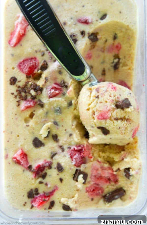 Crimson Chip Swirl Bliss 8 Seven scoops of Strawberry Swirl Chocolate Chip Ice Cream in a large clear bowl.