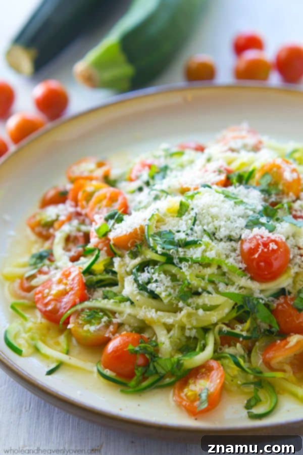 Light Parmesan Zoodles with Sweet Cherry Tomatoes 2 Parmesan Zucchini Noodles with Cherry Tomatoes, made in one pan in only 10 minutes. A simple and healthy vegetarian meal you'll want to make again and again!