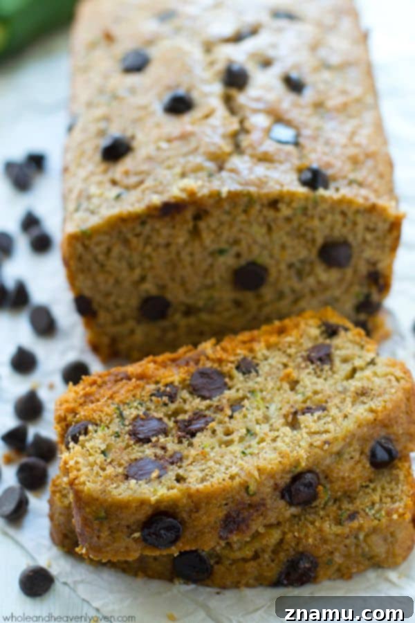 Moist, soft, and perfectly spiced zucchini bread loaded with dark chocolate chips, surprisingly healthy.