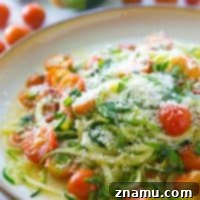 Light Parmesan Zoodles with Sweet Cherry Tomatoes 10 Parmesan Zucchini Noodles with Cherry Tomatoes, a delicious and healthy vegetarian meal.