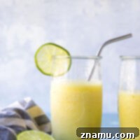 Tropical Pineapple Margarita Slush 8 Refreshing pineapple margarita slushies in glasses