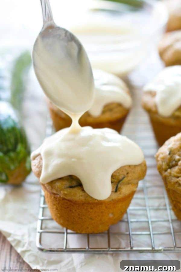 Glazed Zucchini Banana Muffins 6 Close-up of a muffin with thick cream cheese glaze
