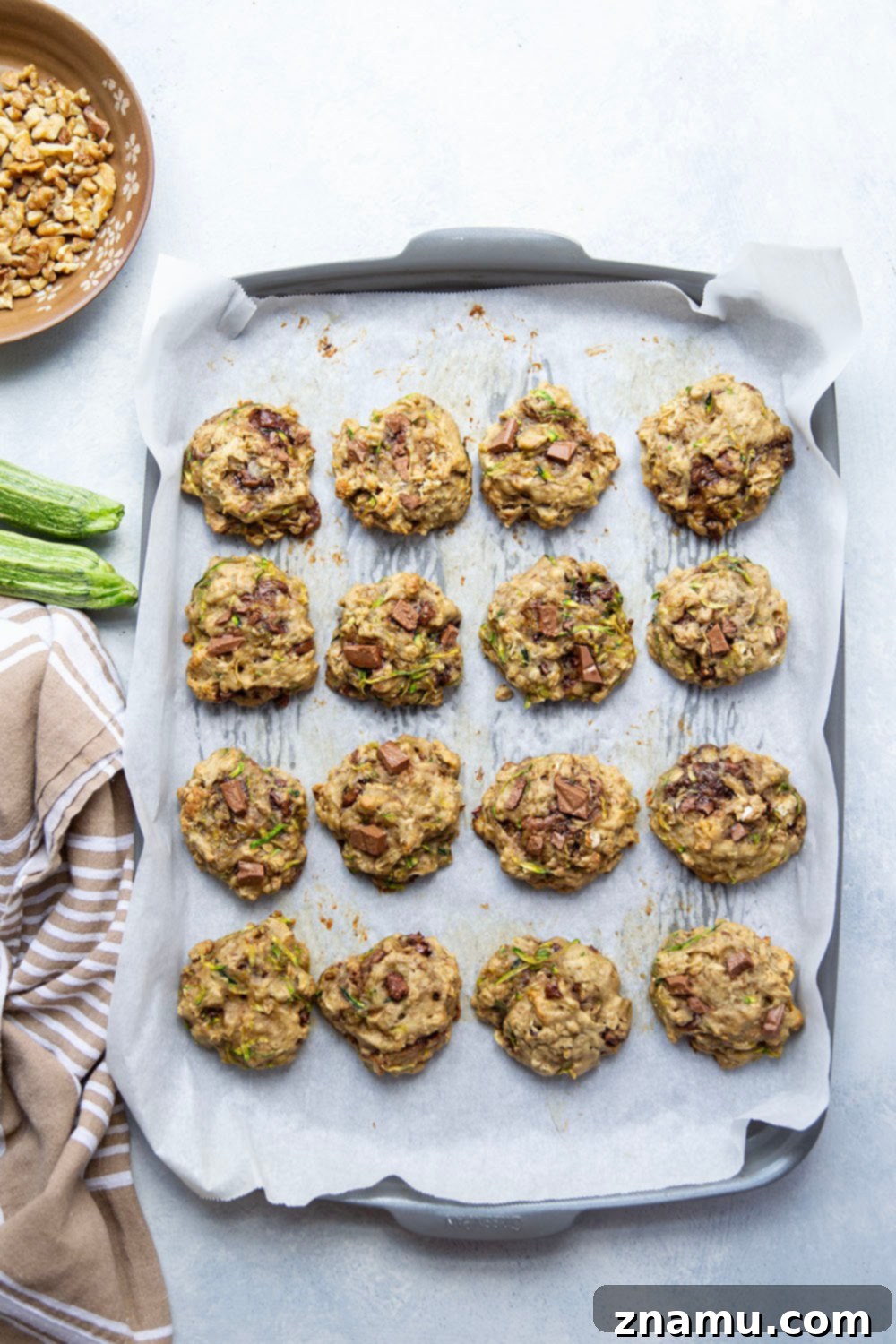 Wholesome Zucchini Breakfast Cookies 4 A stack of Zucchini Breakfast Cookies on a cooling rack, highlighting their golden brown edges.