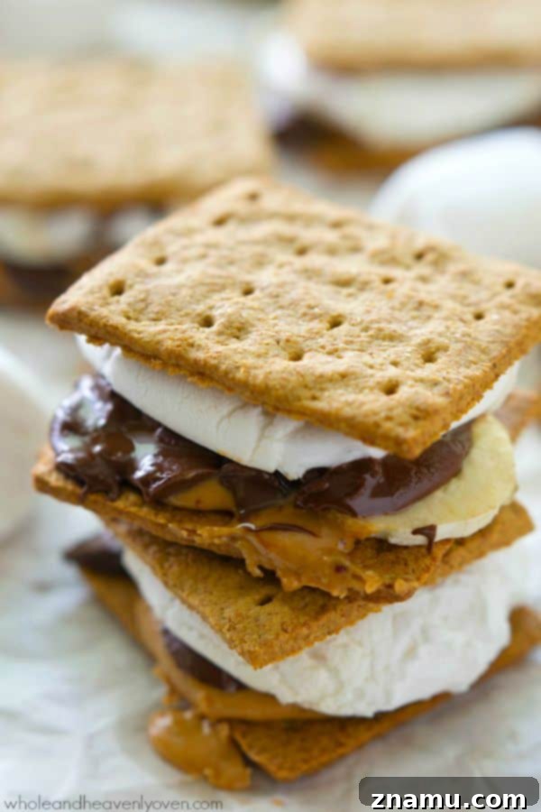 A final close-up of the delicious peanut butter banana s'mores stacked on a plate