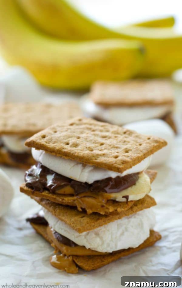 A plate of freshly made peanut butter banana s'mores, showcasing the gooey centers