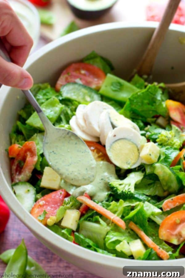 Another perspective of the freshly prepared Rainbow Veggie Chef's Salad, showcasing its inviting presentation.