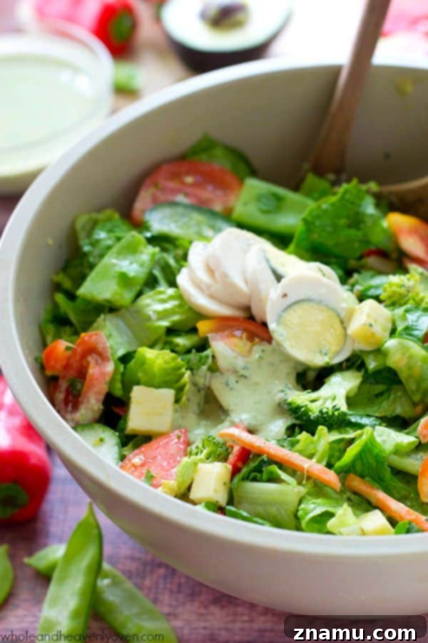 A close up of the Rainbow Veggie Chef's Salad, emphasizing the variety of fresh ingredients.