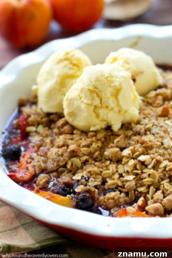Sweet Peach Blueberry Oat Crumble 3 Close-up of fresh peaches and blueberries ready for baking, showcasing the vibrant colors of summer fruit.
