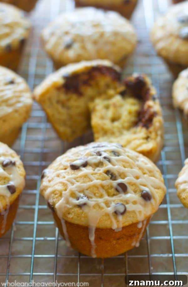 Cinnamon Roll Surprise Chocolate Chip Muffins 2 Cinnamon Roll-Stuffed Chocolate Chip Muffins with glaze and chocolate chips