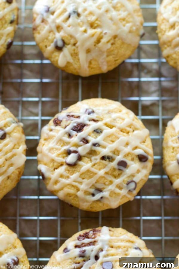 Cinnamon Roll Surprise Chocolate Chip Muffins 7 Cinnamon Roll-Stuffed Chocolate Chip Muffin torn open to show gooey center