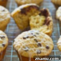 Cinnamon Roll Surprise Chocolate Chip Muffins 8 Stuffed with a luscious gooey cinnamon roll filling and packed with lots of gooey chocolate and glaze, these dynamite muffins are the absolute best way to get your cinnamon roll fix!