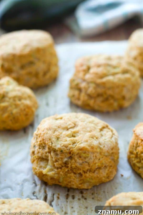 Savory Zucchini Parmesan Buttermilk Biscuits 4 Several homemade zucchini Parmesan biscuits stacked and ready to eat.