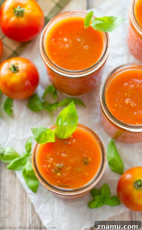 Slow-roasted for hours in plenty of herbs and garlic, this tomato sauce packs in the absolute BEST flavors of summer! --- It's awesome on top of pasta and freezes wonderfully. @WholeHeavenly