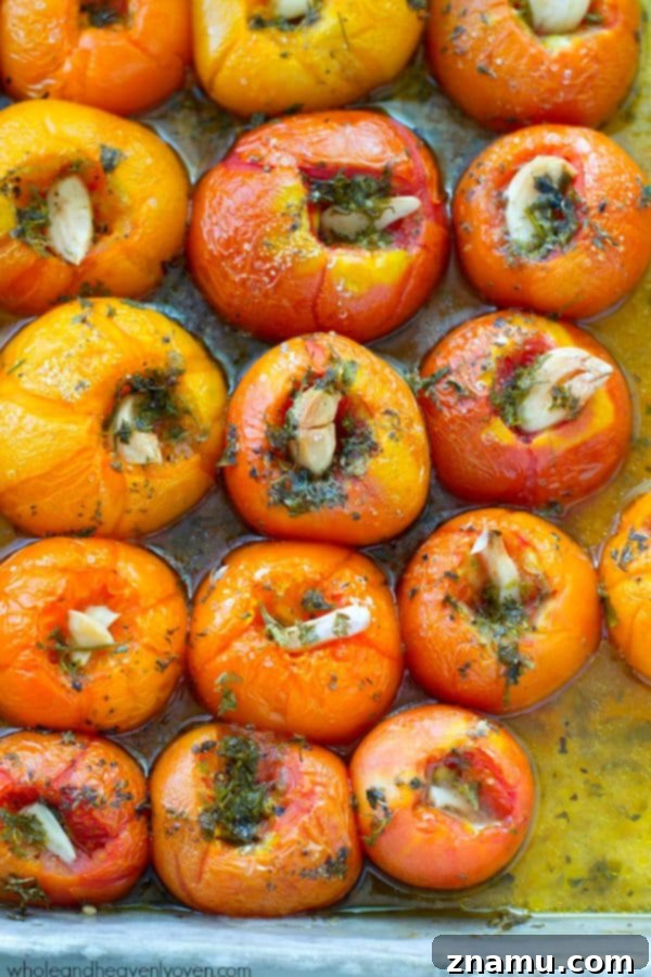 Slow-roasted for hours in plenty of herbs and garlic, this tomato sauce packs in the absolute BEST flavors of summer! --- It's awesome on top of pasta and freezes wonderfully. @WholeHeavenly