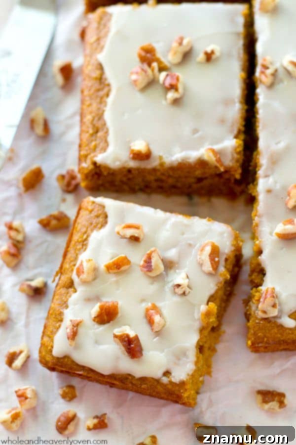 Velvet Pumpkin Spice Glaze Bars 8 A close-up showing the interior texture of a glazed pumpkin bar, revealing its moist and tender crumb.