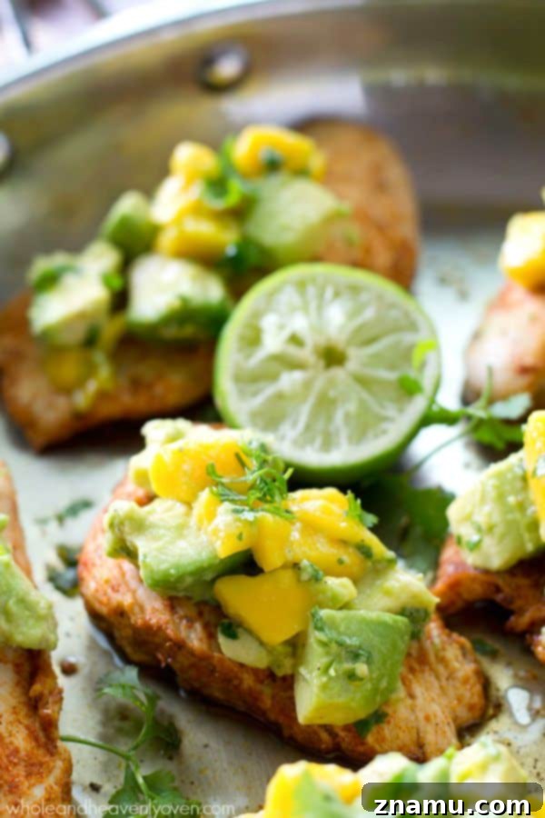 Bayou Blaze Chicken with Tropic Fruit Salsa 7 An appetizing plate of Cajun chicken tenders with mango avocado salsa, ready to be enjoyed