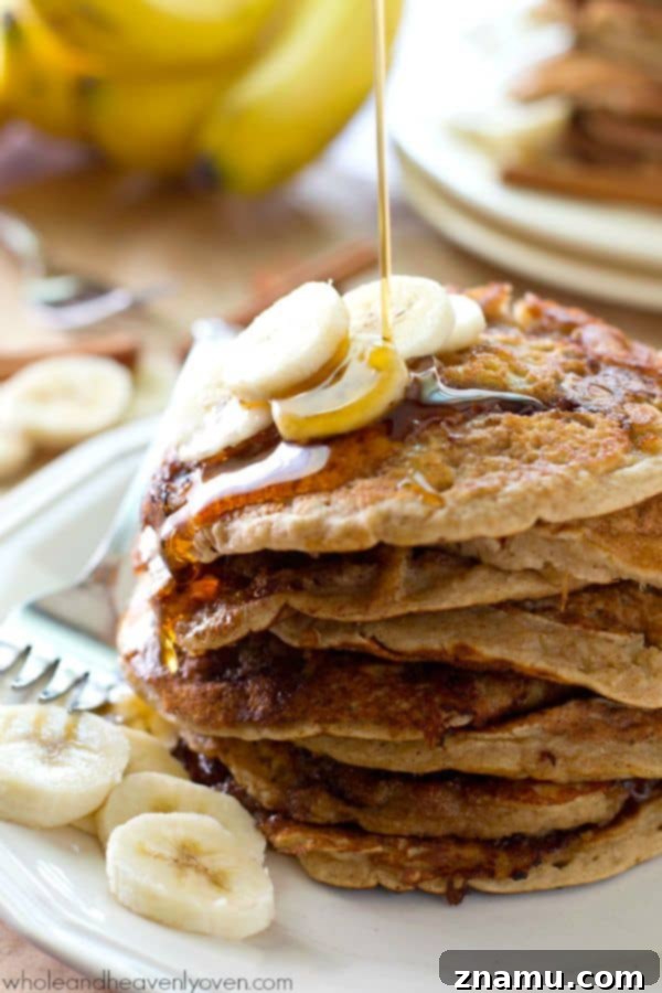 Bakery Banana Swirl Pancakes 7 Detailed shot of the cinnamon swirl inside a cooked banana bread pancake, revealing its gooey texture and enticing aroma, perfect for a sweet breakfast.