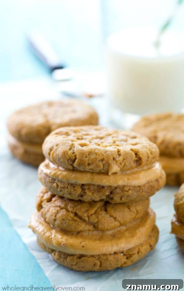 Beautifully arranged peanut butter sandwich cookies on a serving plate, inviting you to take a bite.