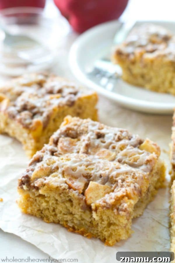 Unbelievably moist and loaded with apples, plenty of streusel, and glaze, you'll definitely savor every last crumb of this ultimate fall coffee cake! @WholeHeavenly