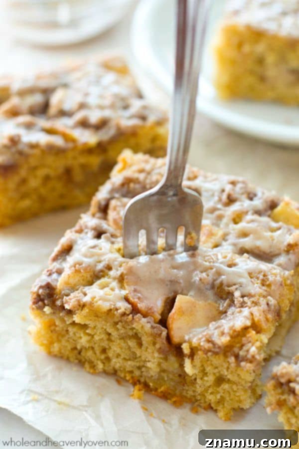 Unbelievably moist and loaded with apples, plenty of streusel, and glaze, you'll definitely savor every last crumb of this ultimate fall coffee cake! @WholeHeavenly