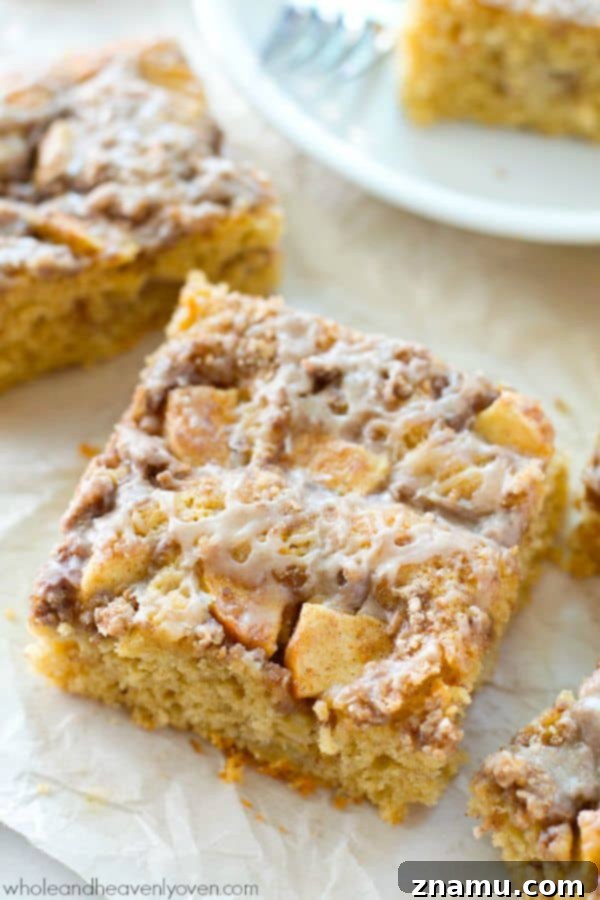 Unbelievably moist and loaded with apples, plenty of streusel, and glaze, you'll definitely savor every last crumb of this ultimate fall coffee cake! @WholeHeavenly