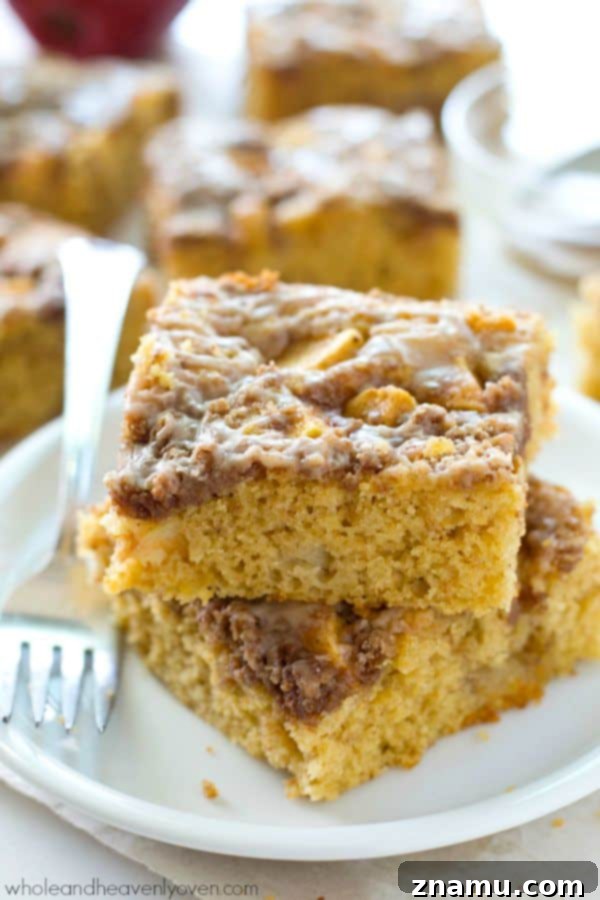 Unbelievably moist and loaded with apples, plenty of streusel, and glaze, you'll definitely savor every last crumb of this ultimate fall coffee cake! @WholeHeavenly