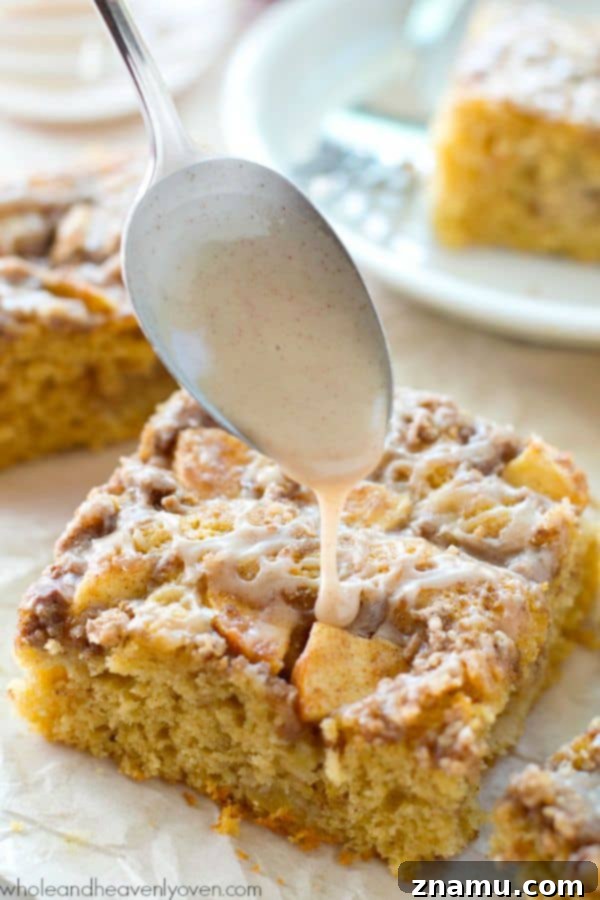 Unbelievably moist and loaded with apples, plenty of streusel, and glaze, you'll definitely savor every last crumb of this ultimate fall coffee cake! @WholeHeavenly