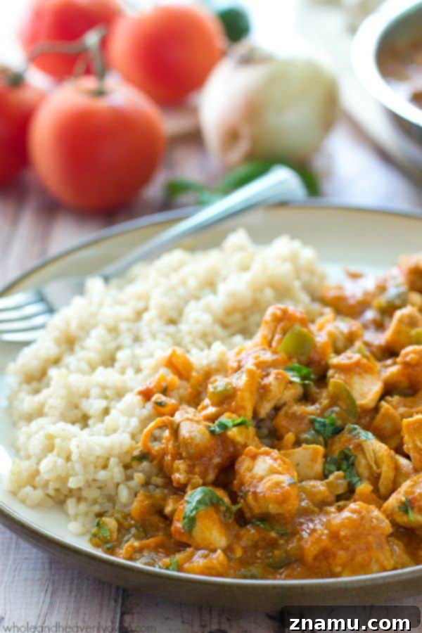 Chicken thighs are marinated in a flavorful, spiced yogurt marinade, then grilled and thrown into an incredible made-from-scratch tikki masala tomato sauce.---Serve with rice for a winner weeknight dinner!