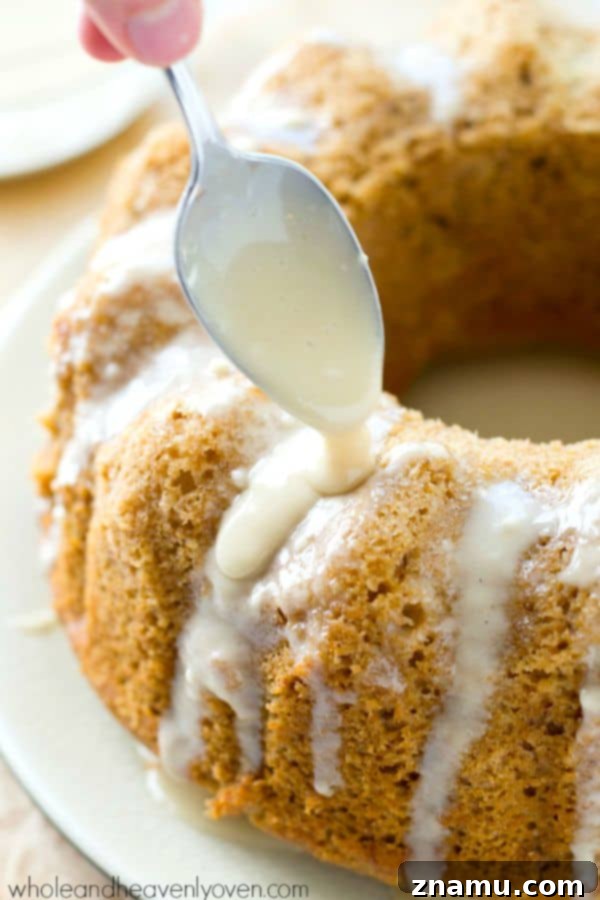 Apple Orchard Bundt with Sweet Glaze 8 Serving a Slice of Glazed Apple Bundt Cake