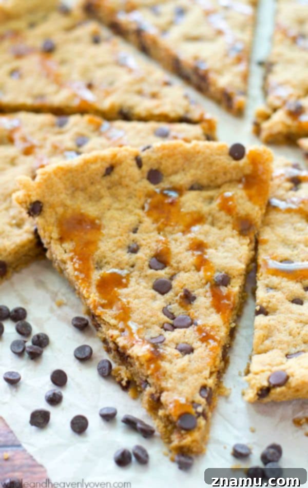 Gooey Flourless Caramel Chocolate Chip Skillet Cookie 3 A close-up of the giant flourless skillet cookie, showcasing its rich chocolate chips and golden-brown edges, ready for a generous caramel drizzle. @WholeHeavenly