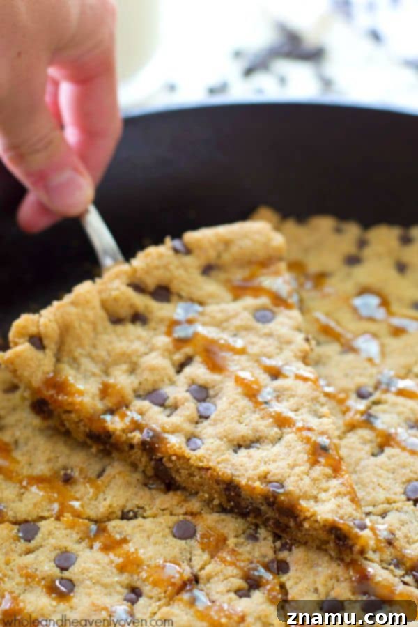 Gooey Flourless Caramel Chocolate Chip Skillet Cookie 5 A large flourless caramel chocolate chip skillet cookie, freshly baked and glistening with melted caramel, waiting to be served warm. @WholeHeavenly