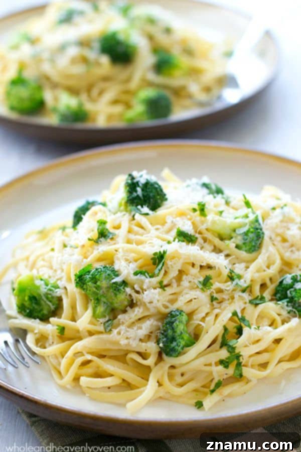 Broccoli Garlic Fettuccine Alfredo in 20 Minutes 7 A full bowl of fettuccine alfredo with broccoli, ready for a delicious meal.