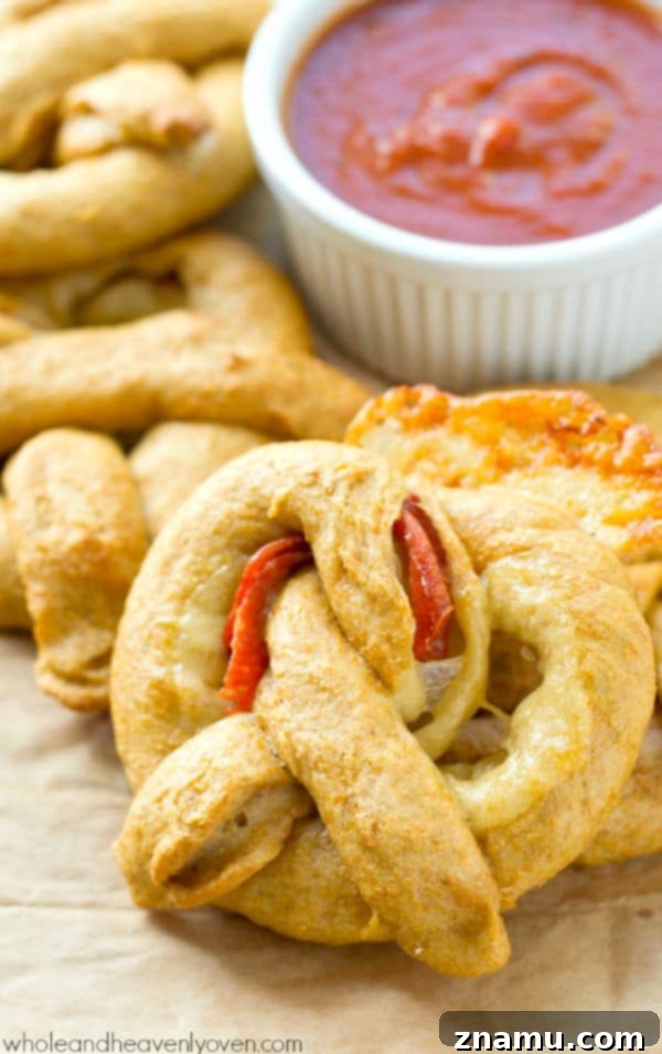 Pizza Pretzel Pockets 2 Exploding with gooey cheese and pepperoni slices, these crowd-pleasing soft pretzels are guaranteed to disappear the second you put them out! @WholeHeavenly