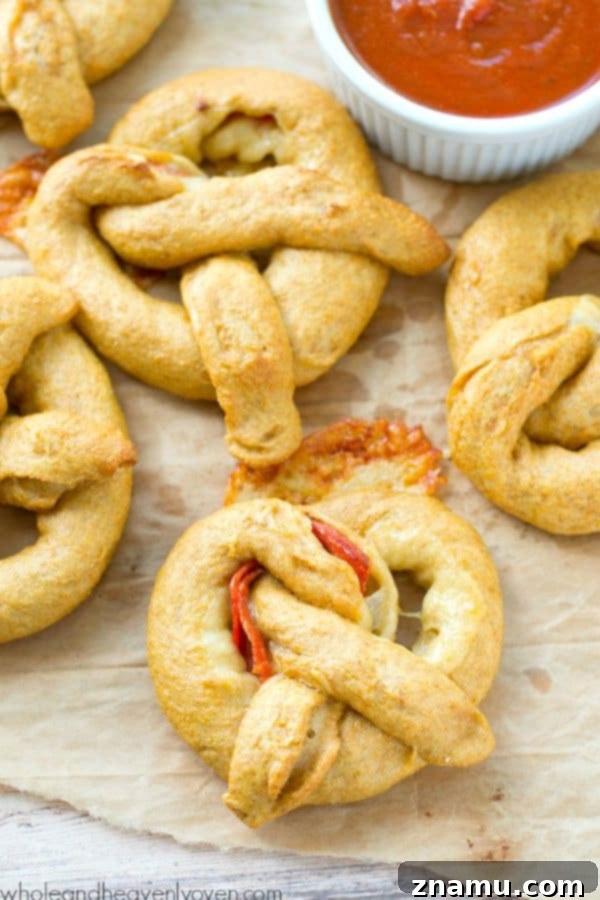 Pizza Pretzel Pockets 3 Exploding with gooey cheese and pepperoni slices, these crowd-pleasing soft pretzels are guaranteed to disappear the second you put them out! @WholeHeavenly