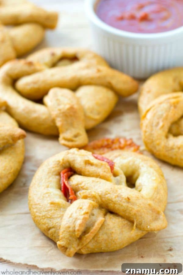 Pizza Pretzel Pockets 4 Exploding with gooey cheese and pepperoni slices, these crowd-pleasing soft pretzels are guaranteed to disappear the second you put them out! @WholeHeavenly