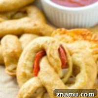 Pizza Pretzel Pockets 9 Exploding with gooey cheese and pepperoni slices, these crowd-pleasing soft pretzels are guaranteed to disappear the second you put them out!