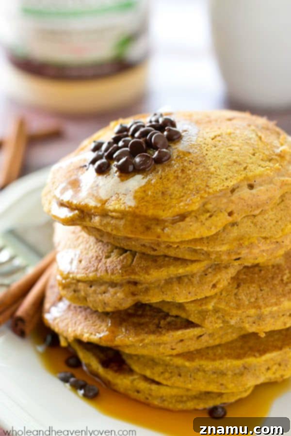 Autumn's Coconut Pumpkin Spice Pancakes 6 A delectable stack of pumpkin spice pancakes, generously topped with maple syrup.