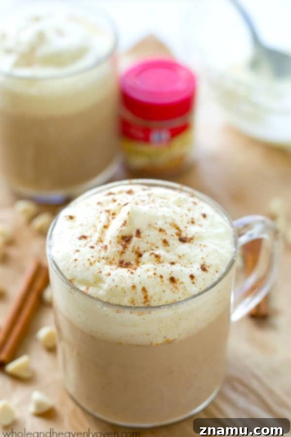 Pumpkin Spice White Chocolate Mocha 3 Close-up shot of a White Chocolate Pumpkin Spice Mocha, showcasing the rich texture and inviting steam, ready to be enjoyed.