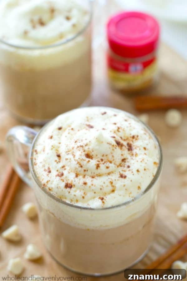 Pumpkin Spice White Chocolate Mocha 4 A vibrant overhead view of a White Chocolate Pumpkin Spice Mocha, highlighting the colorful toppings and inviting texture.