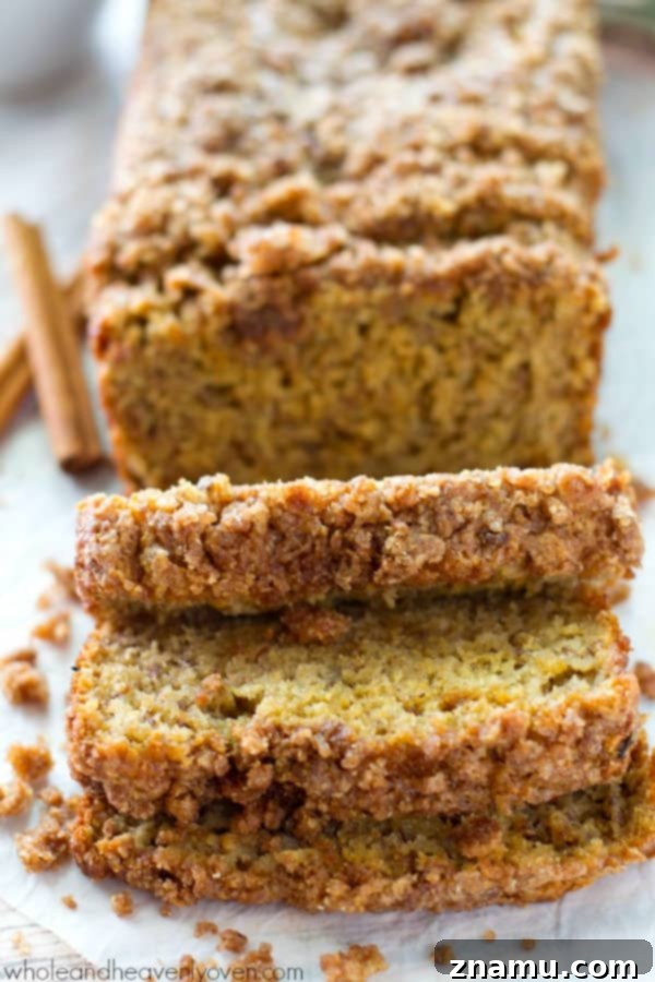 Cinnamon Streusel Banana Coffee Cake 2 A slice of irresistible Cinnamon Streusel Coffee Cake Banana Bread, showcasing its golden crumb and generous streusel topping. Perfect for breakfast or a sweet treat.