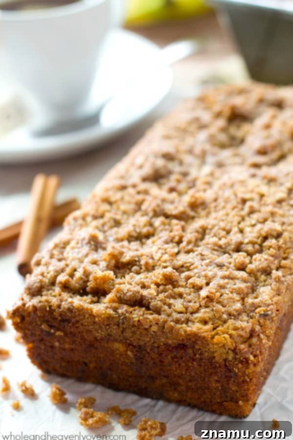 Cinnamon Streusel Banana Coffee Cake 5 The banana bread batter prepared in loaf pans, topped with a generous layer of cinnamon streusel, ready for baking.
