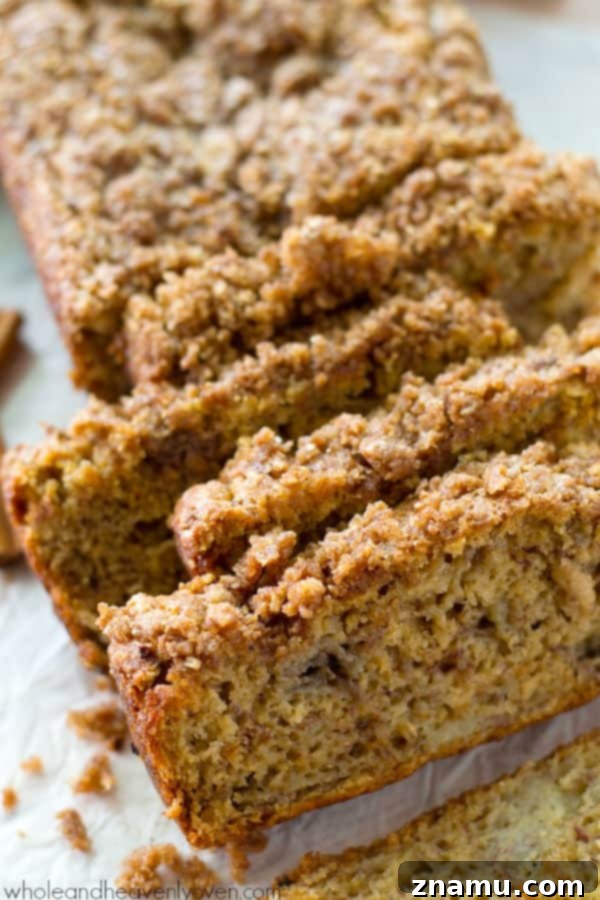 Cinnamon Streusel Banana Coffee Cake 7 A perfect slice of Cinnamon Streusel Coffee Cake Banana Bread, showing the moist banana bread base and the rich streusel layer.