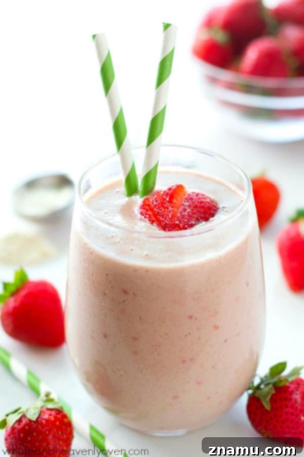 PB&J Power Up Smoothie 5 Ingredients for the Peanut Butter and Jelly Protein Smoothie laid out, including a banana, strawberries, peanut butter, and yogurt.