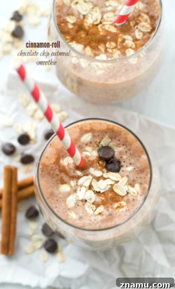 PB&J Power Up Smoothie 10 A tall glass of creamy Cinnamon Roll Oatmeal Chocolate Chip Smoothie, topped with whipped cream and cinnamon drizzle.