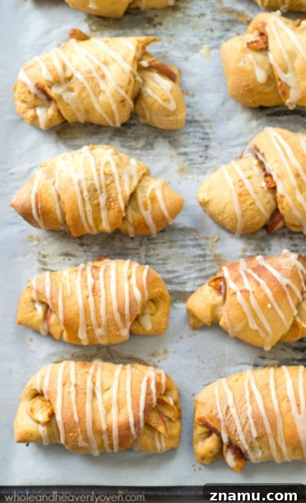 Sweet Glazed Apple Pie Crescents 5 Close-up of fluffy apple pie crescent rolls with thick glaze