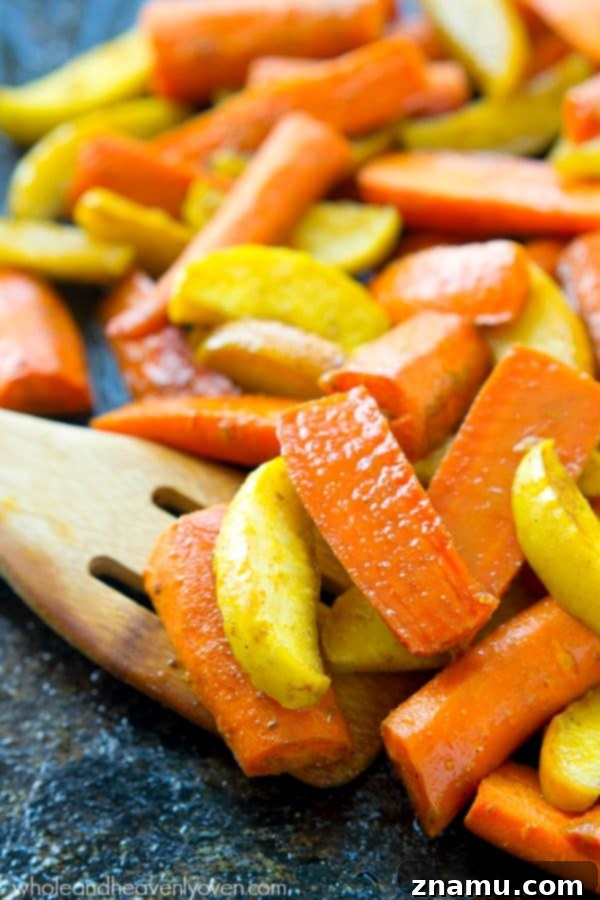Moroccan Maple Caramelized Carrots and Apples 4 A baking sheet filled with perfectly roasted Moroccan Maple-Roasted Carrots and Apples, ready to be served as a delightful fall side dish.