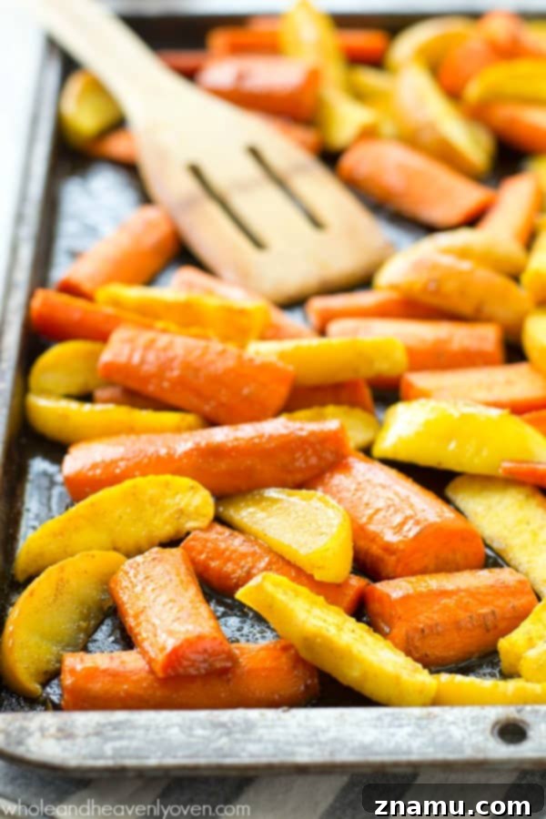 Moroccan Maple Caramelized Carrots and Apples 6 Moroccan Maple-Roasted Carrots and Apples served in a rustic bowl, showcasing their vibrant colors and appealing texture, perfect for any fall gathering.