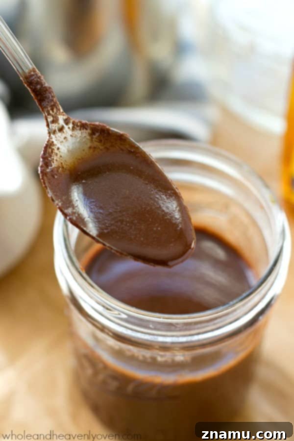Easy 4-Ingredient Agave Mocha Coffee Syrup 6 Rich Agave Mocha Coffee Syrup being poured from a jar.