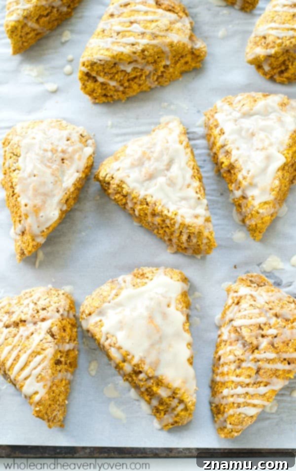 Autumn Cafe Pumpkin Spice Scones 6 A stack of golden-brown pumpkin spice scones, fresh from the oven, awaiting their glaze.